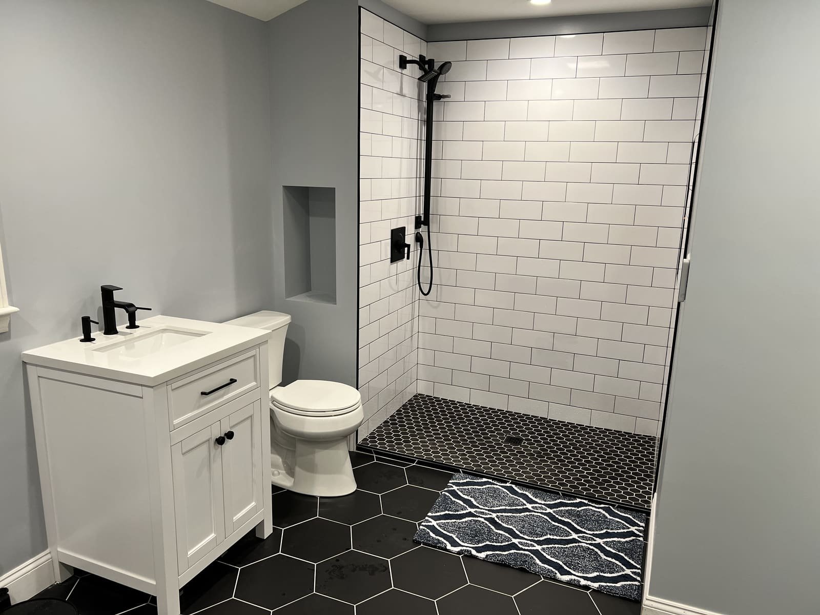 Vanity and subway-tile shower — Precision Plumbing Solutions