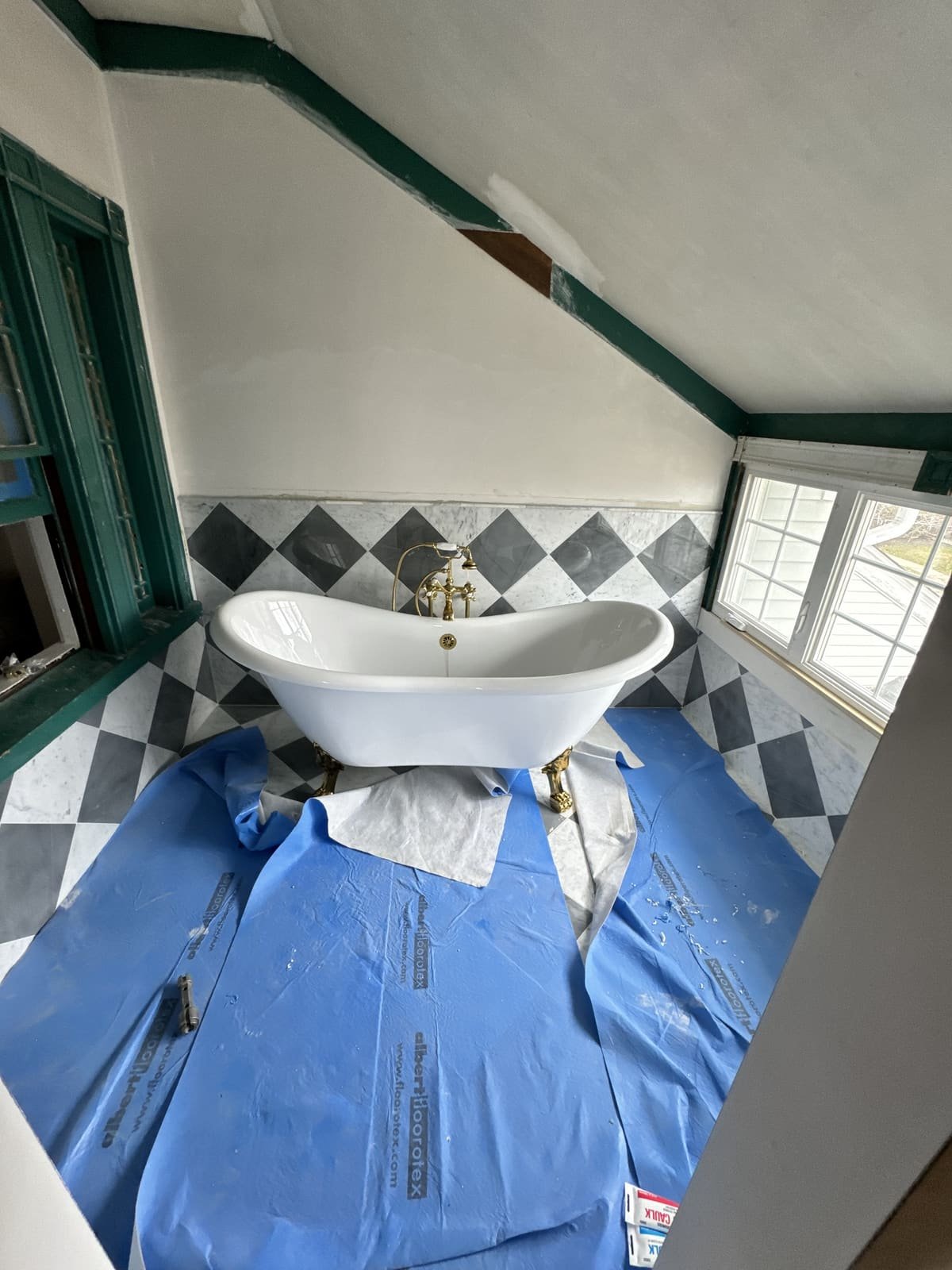Clawfoot tub supply lines being installed mid-job by Precision Plumbing Solutions