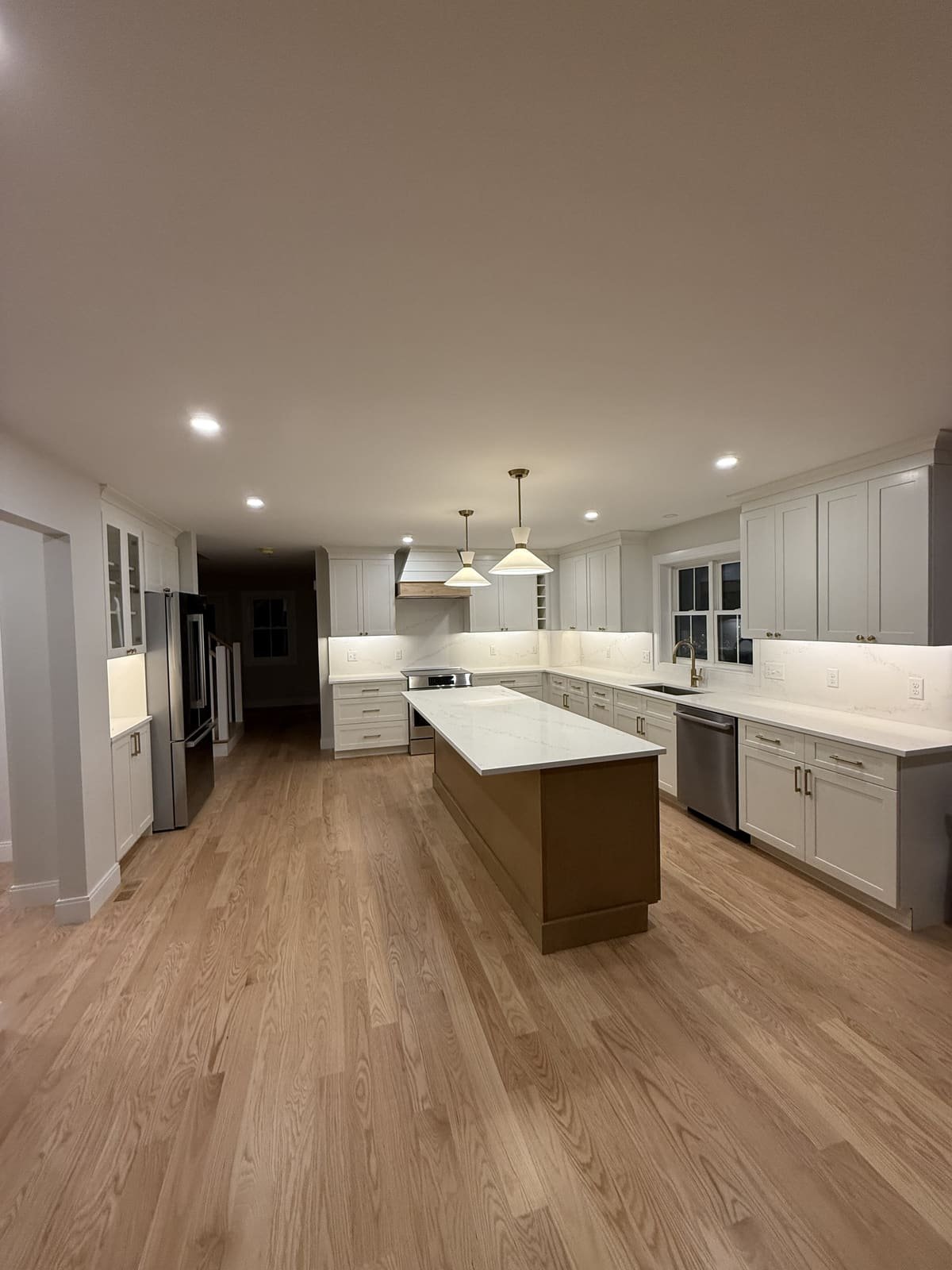 Remodeled kitchen with island sink plumbing completed by Precision Plumbing Solutions